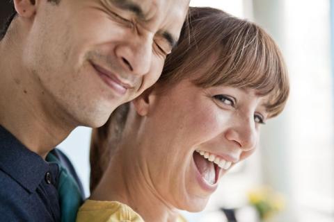 young couple smiling and laughing
